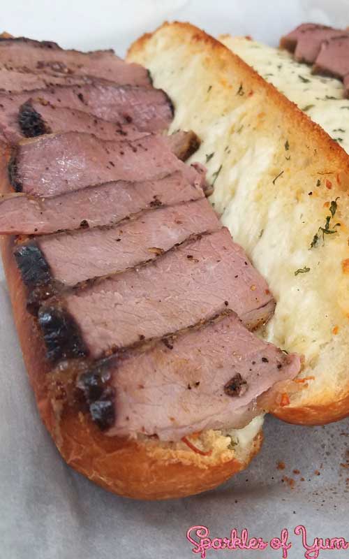 Slow wood smoked brisket on a cheesy garlic bread. You are going to fall in love with this sandwich. 