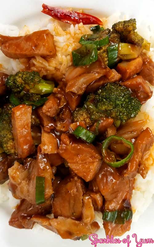 Pork sauce and roasted garlic with broccoli and green onion over white rice.