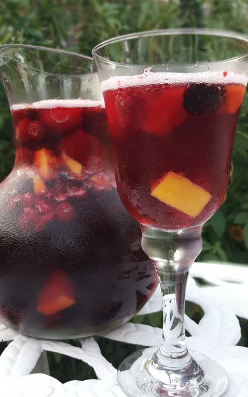 This recipe for Sparkling Mango Berry Sangria is a perfect and super-simple way to celebrate summer, or any day for that matter.