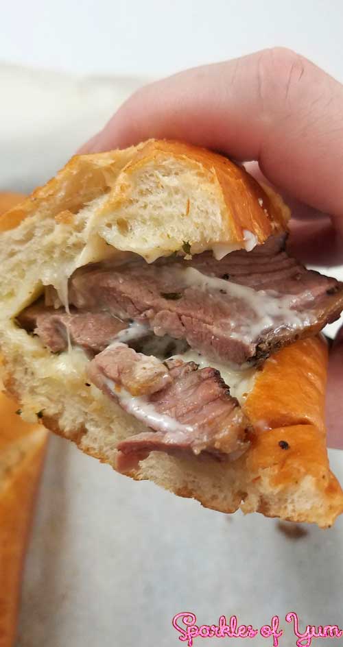 Slow wood smoked brisket on a cheesy garlic bread. You are going to fall in love with this sandwich.