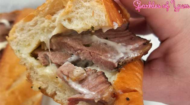 Slow wood smoked brisket on a cheesy garlic bread. You are going to fall in love with this sandwich. 