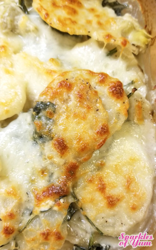 This Spinach and Artichoke Scalloped Potatoes recipe is absolutely delish! So creamy and cheesy. This takes scalloped potatoes to a whole new level.
