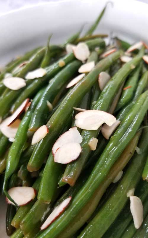 French Green Beans with Almonds Recipe - French Green Beans that are buttery and nutty, with a hint of lemon and garlic for some extra tasty goodness!