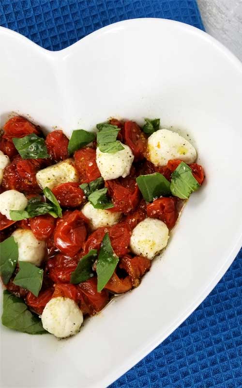 Roasted Tomato Caprese Salad Recipe - A truly delicious little salad to go with just about anything, something a little different. It only looks like you splurged, when in reality it couldn't be more budget friendly, or easy.