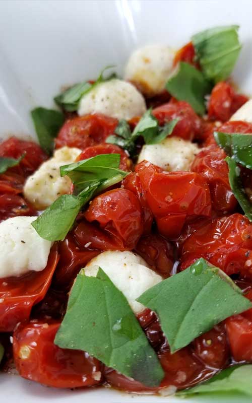 Roasted Tomato Caprese Salad Recipe - A truly delicious little salad to go with just about anything, something a little different. It only looks like you splurged, when in reality it couldn't be more budget friendly, or easy.