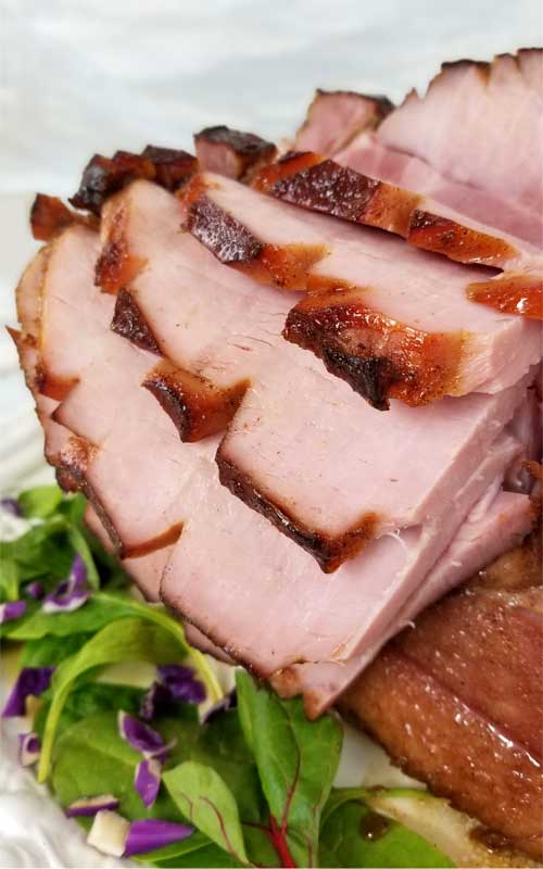 TA DA!! Between the deep, smoky, sweet flavors from the bourbon to the fragrance of the warm spices caramelizing on the ham; it's hard not to pick pieces off of this Southern Honey Bourbon Glazed Ham before it's ready to hit the table.