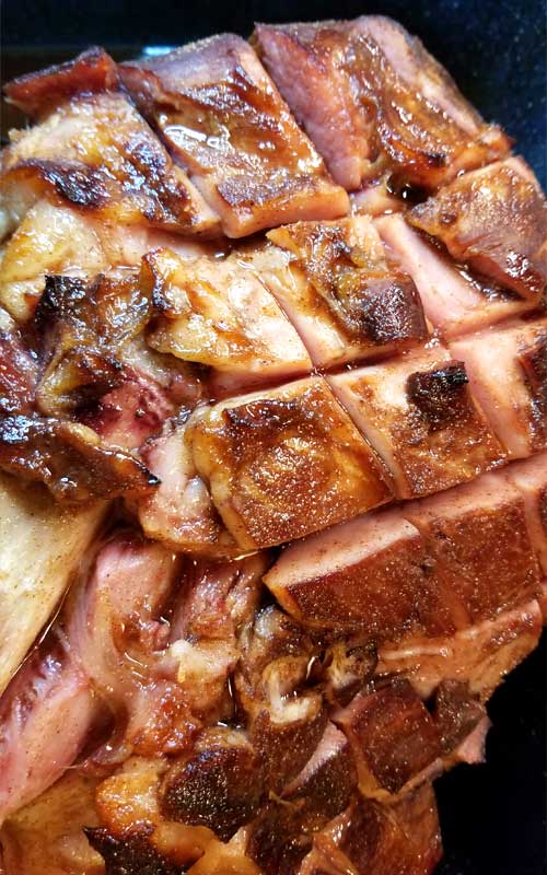 TA DA!! Between the deep, smoky, sweet flavors from the bourbon to the fragrance of the warm spices caramelizing on the ham; it's hard not to pick pieces off of this Southern Honey Bourbon Glazed Ham before it's ready to hit the table.