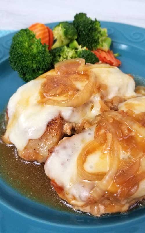 This recipe for French Onion Pork Chops is a keeper! Served right from the skillet in under 30 minutes, it doesn't get any easier. The chops come out tender and juicy, smothered in onion gravy and cheesy goodness! And the clean-up is a breeze too!
