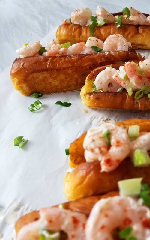 Sweet shrimp slathered in a lemon dill mayo sauce, all jammed into a potato roll. It's like taking your taste buds on a trip to a New England beach, all without leaving town. 