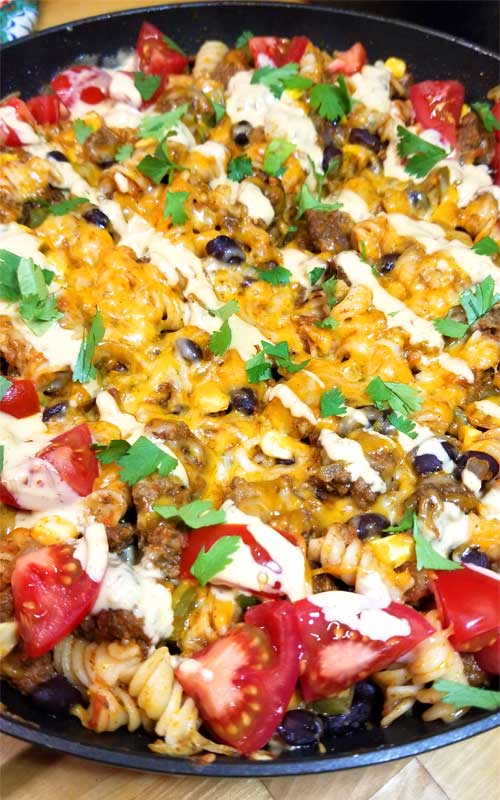 Delicioso, family friendly, quick dinner with easy clean up. This Tex-Mex Fiesta Skillet recipe checks all the boxes for the perfect weeknight meal in my book, and it's pretty too!