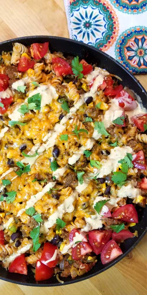 Delicioso, family friendly, quick dinner with easy clean up. This Tex-Mex Fiesta Skillet recipe checks all the boxes for the perfect weeknight meal in my book, and it's pretty too!