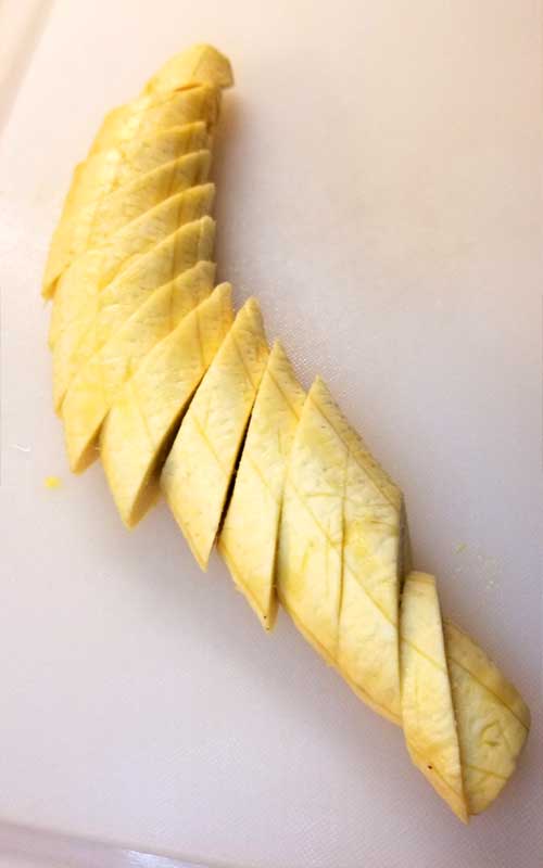 A plantain that has been cut into slices.
