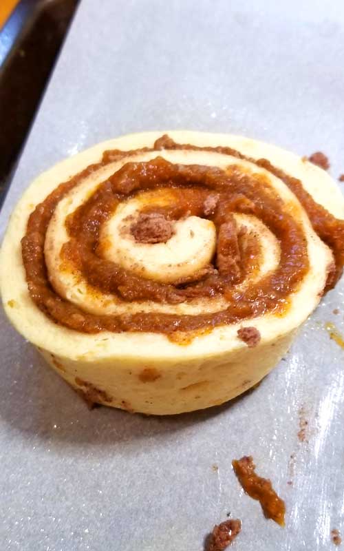 These Super Easy Pumpkin Butter Cinnamon Rolls are toasty warm, fresh from the oven. They are so delicious, extra rich, and gooey with spiced pumpkin butter and melty cream cheese frosting and a little caramel drizzle to top it all off with.