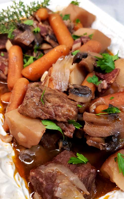 No knife needed, spoon tender, and so much flavor. You can't go wrong with this Instant Pot Beef Bourguignon, and it's EASY.