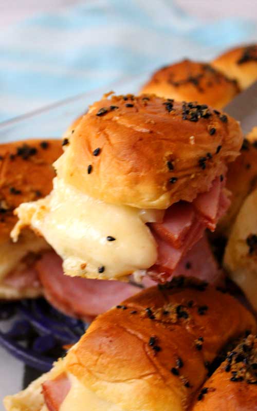 Sink your teeth into these Ham and Cheese Sliders and you won't be able to stop at one. They are so good, you'll want them at every party!