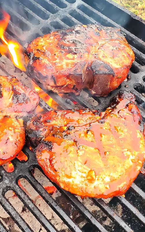 These Korean BBQ Pork Chops are packed with with a little sweet, a little heat, and a lot of juicy. A ton of smoky flavor and super tender. These are among some of the best pork chops we have ever ate! #grilling #porkchops #Korean #dinnerideas