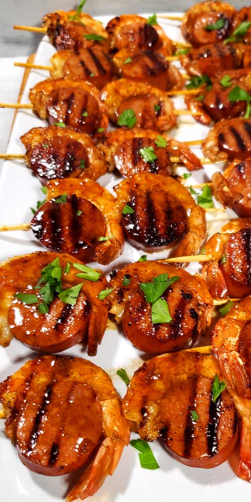 These Glazed New Orleans BBQ Shrimp & Sausage Kabobs are kind of magical because they disappear before your eyes. I'm not kidding I set these out for a party and poof gone, all gobbled up.