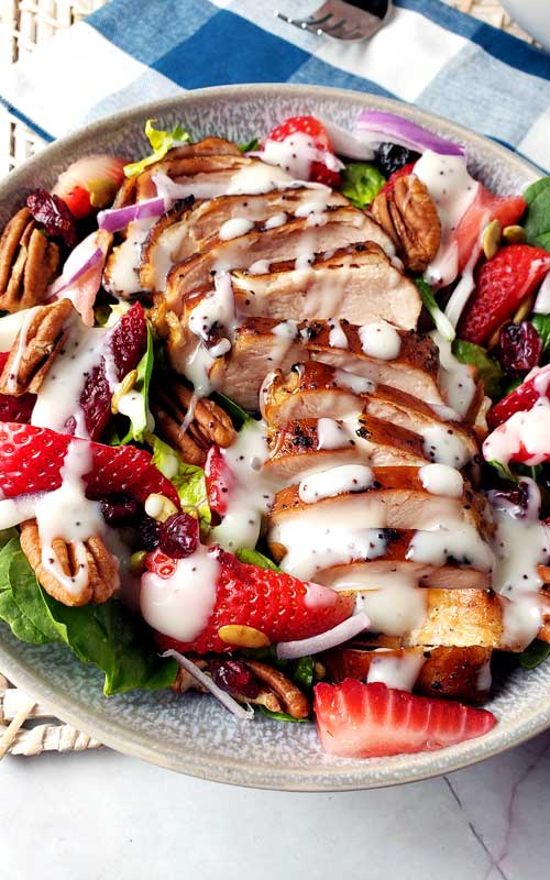 This Summer Strawberry Spinach Salad with Chicken is so tasty and refreshing for a hot day. It's simple, healthy, and incredibly delicious!