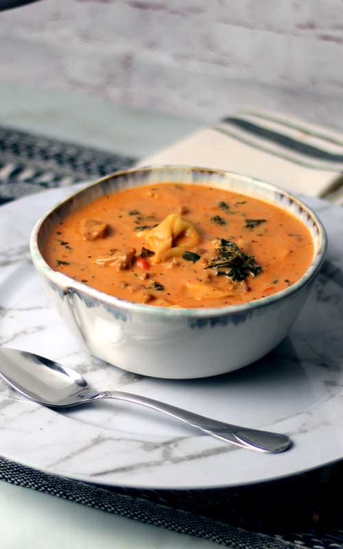 Creamy Sausage Tortellini Soup is one of my all time favorite soups. The flavors are amazing for such a simple easy recipe and it has everything you need for a big bowl of comfort.